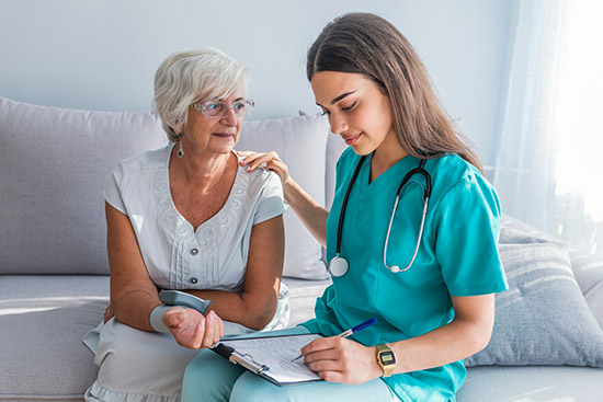 Nurse,Visiting,Senior,Woman,For,Check,Up.,Young,Nurse,Measuring